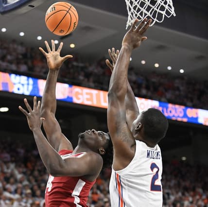 Feb 11, 2023; Auburn, Alabama, USA;  Alabama Crimson Tide center Charles Bediako (14) shoots over Auburn Tigers forward Jaylin Williams (2) at Neville Arena. Mandatory Credit: Julie Bennett-USA TODAY Sports