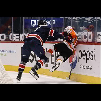 Feb 7, 2021; Washington, District of Columbia, USA; Washington Capitals defenseman Brenden Dillon (4) checks Philadelphia Flyers right wing Travis Konecny (11) while battling for the puck in the third period at Capital One Arena. Mandatory Credit: Geoff Burke-USA TODAY Sports
