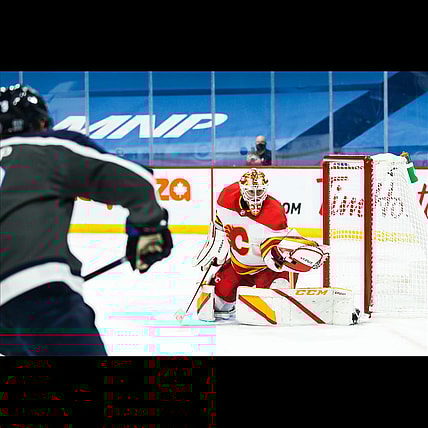 Feb 4, 2021; Winnipeg, Manitoba, CAN; Calgary Flames goalie Jacob Markstrom (25) makes a save on a shot by Winnipeg Jets forward Andrew Copp (9) during the second period at Bell MTS Place. Mandatory Credit: Terrence Lee-USA TODAY Sports