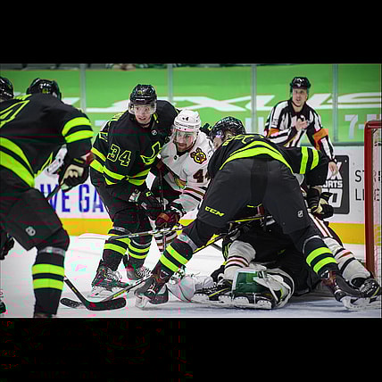 Feb 7, 2021; Dallas, Texas, USA; Dallas Stars right wing Denis Gurianov (34) and defenseman Jamie Oleksiak (2) defend against Chicago Blackhawks defenseman Calvin de Haan (44) during the third period at the American Airlines Center. Mandatory Credit: Jerome Miron-USA TODAY Sports