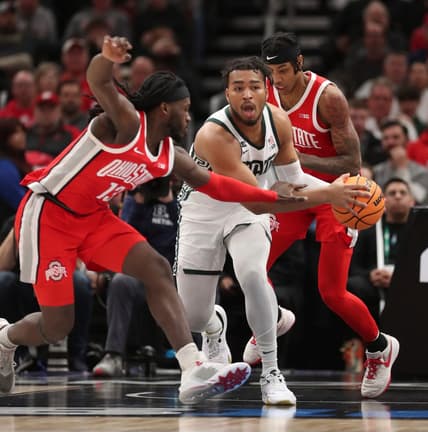 Michigan State Spartans guard Pierre Brooks (1) rebounds against Ohio State Buckeyes guard Isaac Likekele (13) during first-half action in the Big Ten tournament quarterfinals at United Center in Chicago on Friday, March 10, 2023.

Msubig 031023 Kd1665