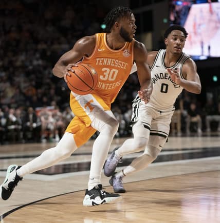 Feb 8, 2023; Nashville, Tennessee, USA;   Tennessee Volunteers guard Josiah-Jordan James (30) drives past Vanderbilt Commodores guard Tyrin Lawrence (0) during the second half at Memorial Gymnasium. Vanderbilt defeated Tennessee 66 to 65.  Mandatory Credit: George Walker IV - USA TODAY Sports