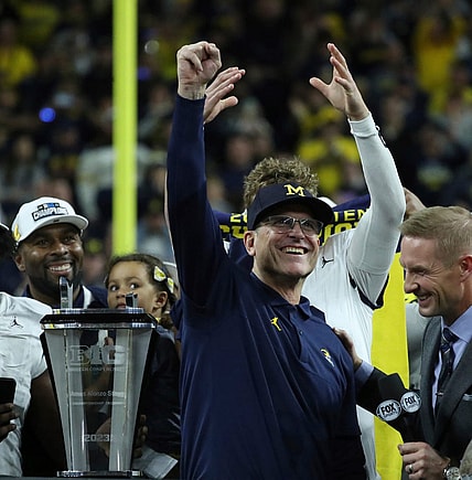 Michigan coach Jim Harbaugh celebrates after U-M's 26-0 win over Iowa in the Big Ten championship game on Saturday, Dec. 2, 2023, in Indianapolis.