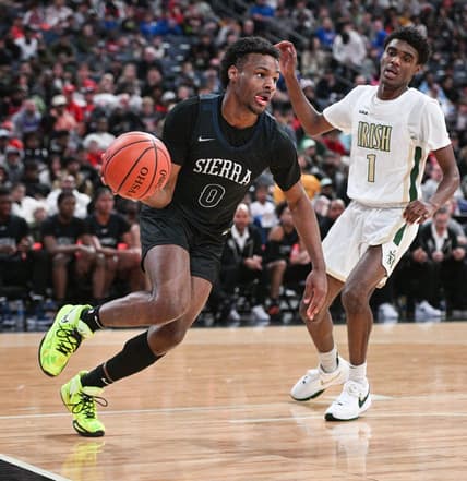 Sierra Canyon's Bronny James drives against Akron St. Vincent-St. Mary's Lance Hayes during the Ohio Play-by-Play Classic on Dec. 17 at Nationwide Arena.