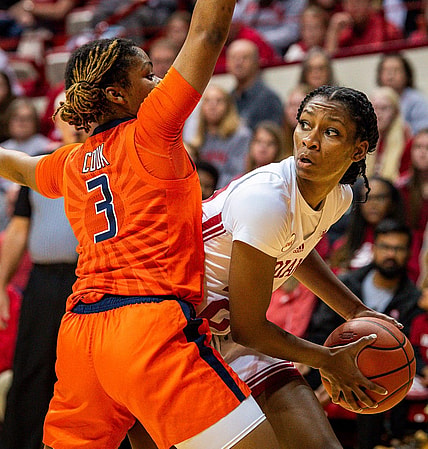 Indiana's Chloe Moore-McNeil (22) looks to pass around Illinois' Makira Cook (3) during the first half of the Indiana versus Illinois women's basketball game at Simon Skjodt Assembly Hall on Sunday, Dec. 31, 2023.