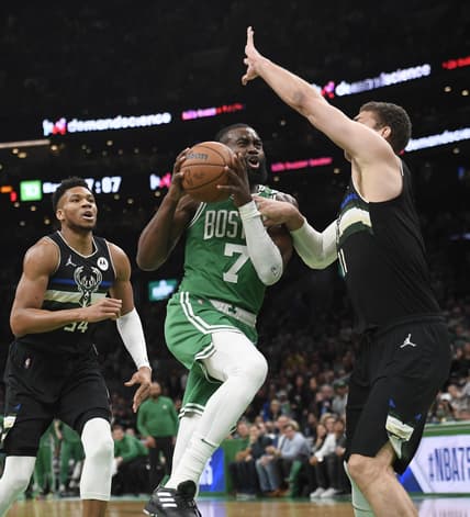 May 3, 2022; Boston, Massachusetts, USA; Boston Celtics guard Jaylen Brown (7) drives to the basket while Milwaukee Bucks center Brook Lopez (11) defends in the first half during game two of the second round for the 2022 NBA playoffs at TD Garden. Mandatory Credit: Bob DeChiara-USA TODAY Sports