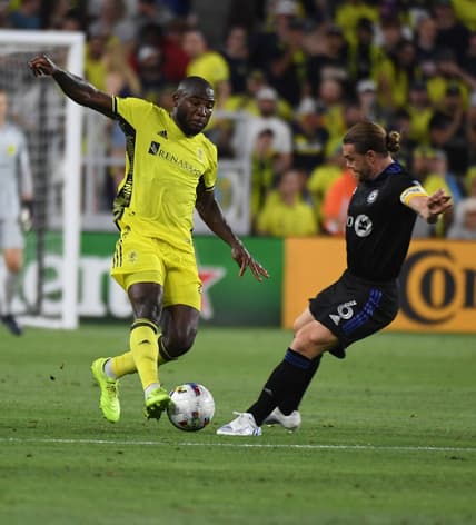 May 18, 2022; Nashville, Tennessee, USA; Nashville SC midfielder Brian Anunga (27) against CF Montreal midfielder Samuel Piette (6) during the second half at GEODIS Park. Mandatory Credit: Christopher Hanewinckel-USA TODAY Sports
