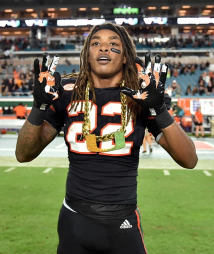 Sheldrick Redwine with Miami turnover chain