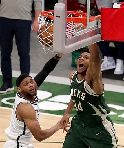 Bucks forward Giannis Antetokounmpo throws down a dunk against Nets forward Bruce Brown during the second quarter.

Mjs Bucks 07513