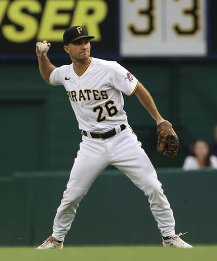 Jul 16, 2021; Pittsburgh, Pennsylvania, USA;  Pittsburgh Pirates second baseman Adam Frazier (26) throws to first base to record an out against the New York Mets during the first inning at PNC Park. Mandatory Credit: Charles LeClaire-USA TODAY Sports
