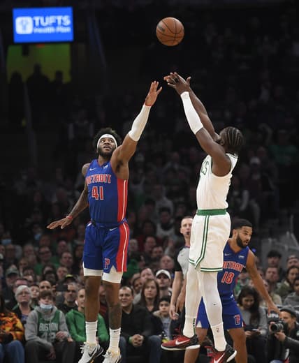 Mar 11, 2022; Boston, Massachusetts, USA;  Boston Celtics guard Jaylen Brown (7) shoots the ball over Detroit Pistons forward Saddiq Bey (41) during the first half at TD Garden. Mandatory Credit: Bob DeChiara-USA TODAY Sports