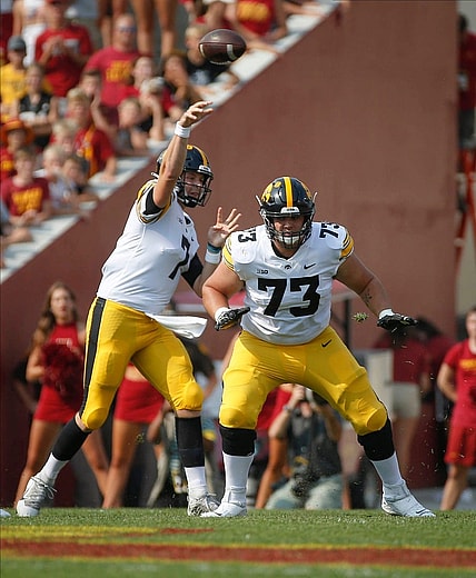 Iowa junior offensive lineman Cody Ince (No. 73) protects the line as junior quarterback Spencer Petras throws a pass in the first quarter against Iowa State at Jack Trice Stadium in Ames on Saturday, Sept. 11, 2021.

20210911 Cyhawk