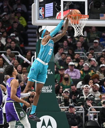 Jan 6, 2023; Milwaukee, Wisconsin, USA; Charlotte Hornets forward Jalen McDaniels (6) dunks the ball in the first half against the Milwaukee Bucks at Fiserv Forum. Mandatory Credit: Michael McLoone-USA TODAY Sports