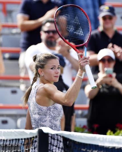 Aug 15, 2021; Montreal, Quebec, Canada; Camila Giorgi of Italy reacts after winning the match and championship point against Karolina Pliskova of the Czech Republic (not pictured) in the singles finals match during the National Bank Open at Stade IGA Mandatory Credit: Eric Bolte-USA TODAY Sports
