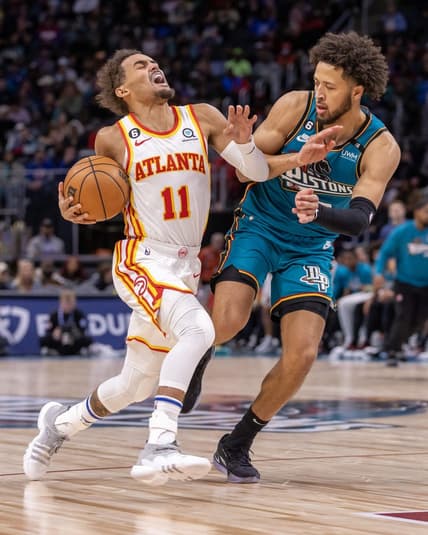 Oct 28, 2022; Detroit, Michigan, USA; Detroit Pistons guard Cade Cunningham (2) defends against Atlanta Hawks guard Trae Young (11) during the first half at Little Caesars Arena. Mandatory Credit: David Reginek-USA TODAY Sports