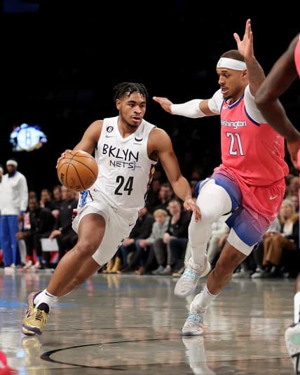 Feb 4, 2023; Brooklyn, New York, USA; Brooklyn Nets guard Cam Thomas (24) drives to the basket against Washington Wizards center Daniel Gafford (21) during the first quarter at Barclays Center. Mandatory Credit: Brad Penner-USA TODAY Sports