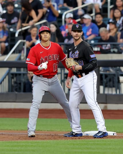 Aug 25, 2023; New York City, New York, USA; Los Angeles Angels designated hitter Shohei Ohtani (17) takes a lead off first base against New York Mets first baseman Pete Alonso (20) after walking during the first inning at Citi Field. Mandatory Credit: Brad Penner-USA TODAY Sports