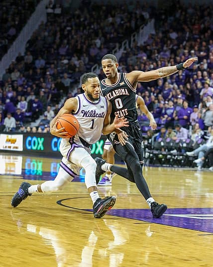 Jan 10, 2023; Manhattan, Kansas, USA; Kansas State Wildcats guard Markquis Nowell (1) drives to the basket against Oklahoma State Cowboys guard Avery Anderson III (0) during the first half at Bramlage Coliseum. Mandatory Credit: Scott Sewell-USA TODAY Sports
