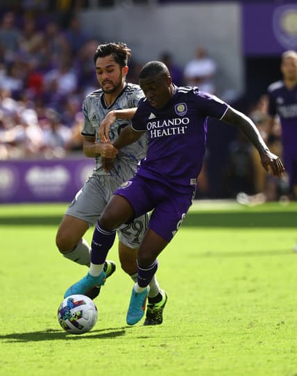 Feb 27, 2022; Orlando, Florida, USA; CF Montreal midfielder Mathieu Choini  re (29) and Orlando City SC midfielder Sebas Mendez (8) fight to control the ball during the second half at Orlando City Stadium. Mandatory Credit: Kim Klement-USA TODAY Sports