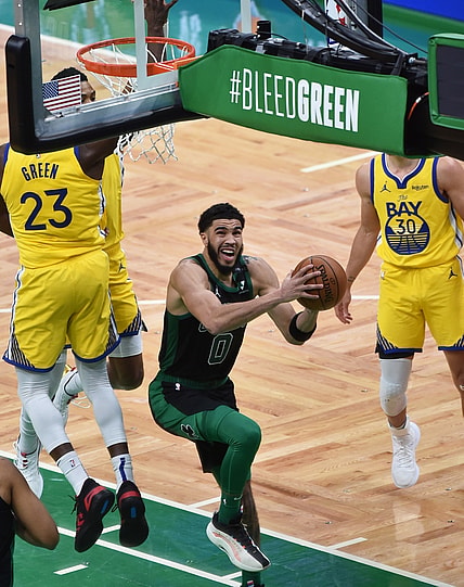 Apr 17, 2021; Boston, Massachusetts, USA;  Boston Celtics forward Jayson Tatum (0) drives to the basket for two points past Golden State Warriors forward Draymond Green (23) during the second half at TD Garden. Mandatory Credit: Bob DeChiara-USA TODAY Sports