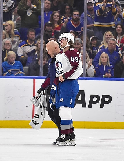 May 21, 2022; St. Louis, Missouri, USA; Colorado Avalanche defenseman Samuel Girard (49) is helped off the ice by a trainer after a hit by the St. Louis Blues during the first period in game three of the second round of the 2022 Stanley Cup Playoffs at Enterprise Center. Mandatory Credit: Jeff Curry-USA TODAY Sports