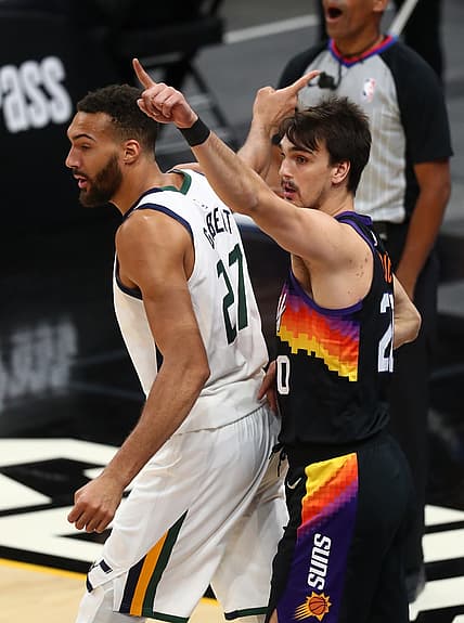 Apr 7, 2021; Phoenix, Arizona, USA; Utah Jazz center Rudy Gobert (27) and Phoenix Suns forward Dario Saric (20) react to an out of bounds ball during the first half at Phoenix Suns Arena. Mandatory Credit: Mark J. Rebilas-USA TODAY Sports