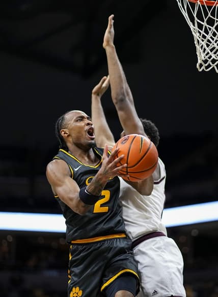 Feb 7, 2024; Columbia, Missouri, USA; Missouri Tigers guard Tamar Bates (2) goes up for a shot against Texas A&M Aggies forward Wildens Leveque (10) during the first half at Mizzou Arena. Mandatory Credit: Jay Biggerstaff-USA TODAY Sports