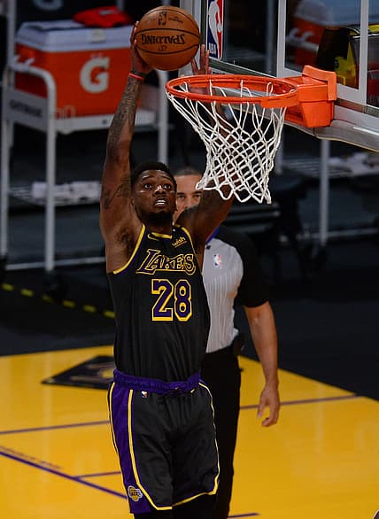 May 12, 2021; Los Angeles, California, USA; Los Angeles Lakers forward Alfonzo McKinnie (28) scores a basket against the Houston Rockets during the second half at Staples Center. Mandatory Credit: Gary A. Vasquez-USA TODAY Sports