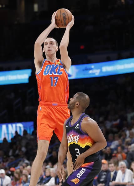 Apr 3, 2022; Oklahoma City, Oklahoma, USA; Oklahoma City Thunder center Aleksej Pokusevski (17) passes the ball as Phoenix Suns guard Chris Paul (3) looks on during the second quarter at Paycom Center. Mandatory Credit: Alonzo Adams-USA TODAY Sports