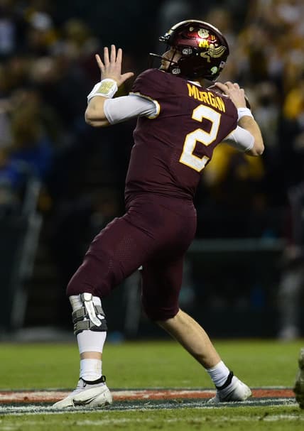 Dec 28, 2021; Phoenix, AZ, USA; Minnesota Golden Gophers quarterback Tanner Morgan (2) throws the ball against the West Virginia Mountaineers during the first half at Chase Field. Mandatory Credit: Joe Camporeale-USA TODAY Sports