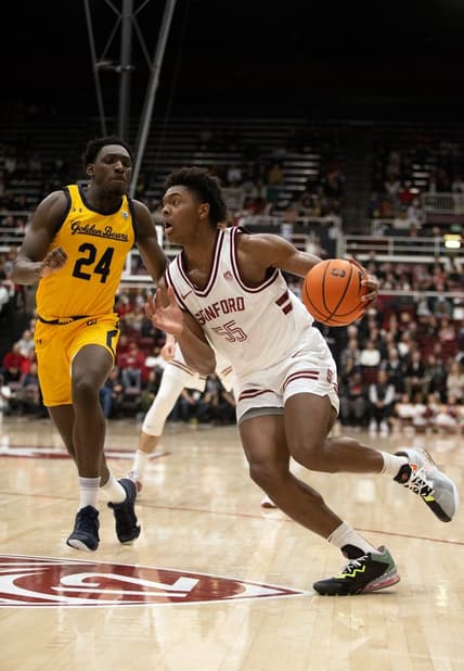Jan 28, 2023; Stanford, California, USA; Stanford Cardinal forward Harrison Ingram (55) drives past California Golden Bears forward Sam Alajiki (24) during the first half at Maples Pavilion. Mandatory Credit: D. Ross Cameron-USA TODAY Sports