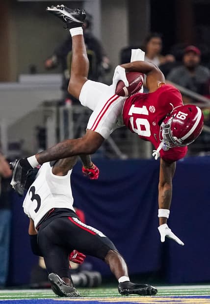 Alabama tight end Jahleel Billingsley (19) is upended by Cincinnati safety Ja'von Hicks (3) in the 2021 College Football Playoff Semifinal game at the 86th Cotton Bowl in AT&T Stadium in Arlington, Texas Friday, Dec. 31, 2021. [Staff Photo/Gary Cosby Jr.]

College Football Playoffs Alabama Vs Cincinnati
