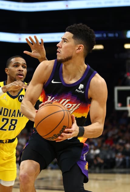 Jan 22, 2022; Phoenix, Arizona, USA; Phoenix Suns guard Devin Booker (1) against the Indiana Pacers in the first half at Footprint Center. Mandatory Credit: Mark J. Rebilas-USA TODAY Sports
