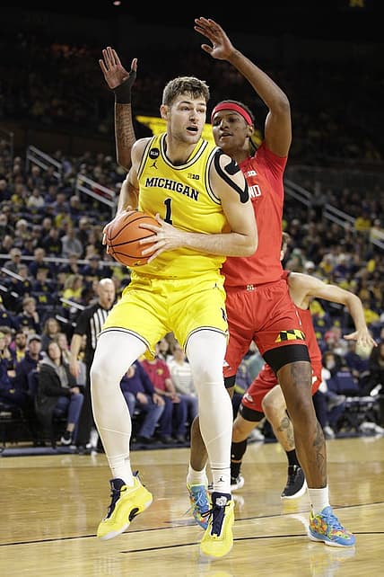Jan 1, 2023; Ann Arbor, Michigan, USA; Michigan Wolverines center Hunter Dickinson (1) handles the ball against Maryland Terrapins forward Julian Reese (10) during the first half at Crisler Center. Mandatory Credit: Brian Bradshaw Sevald-USA TODAY Sports