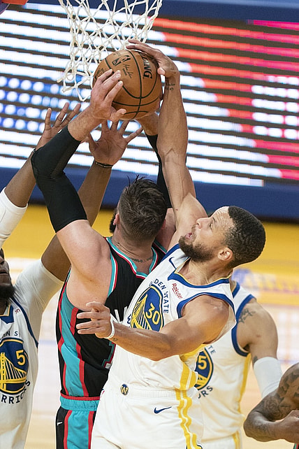 May 16, 2021; San Francisco, California, USA; Golden State Warriors guard Stephen Curry (30) blocks the shot attempt by Memphis Grizzlies center Jonas Valanciunas (17) during the first quarter at Chase Center. Mandatory Credit: Kyle Terada-USA TODAY Sports