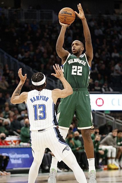Nov 22, 2021; Milwaukee, Wisconsin, USA;  Milwaukee Bucks forward Khris Middleton (22) shoots over Orlando Magic guard R.J. Hampton (13) during the second quarter at Fiserv Forum. Mandatory Credit: Jeff Hanisch-USA TODAY Sports