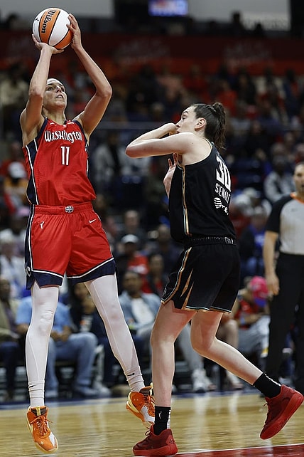 May 19, 2023; Washington, District of Columbia, USA; Washington Mystics forward Elena Delle Donne (11) shoots the ball as New York Liberty forward Breanna Stewart (30) defends at Entertainment & Sports Arena. Mandatory Credit: Geoff Burke-USA TODAY Sports