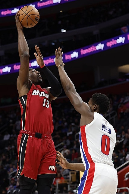Mar 17, 2024; Detroit, Michigan, USA;  Miami Heat center Bam Adebayo (13) shoots on Detroit Pistons center Jalen Duren (0) in the first half at Little Caesars Arena. Mandatory Credit: Rick Osentoski-USA TODAY Sports