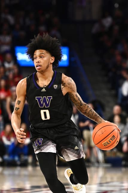 Dec 9, 2022; Spokane, Washington, USA; Washington Huskies guard Koren Johnson (0) brings the ball down court against the Gonzaga Bulldogs in the second half at McCarthey Athletic Center. Mandatory Credit: James Snook-USA TODAY Sports