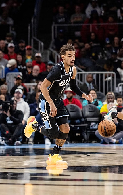 Jan 15, 2024; Atlanta, Georgia, USA; Atlanta Hawks guard Trae Young (11) dribbles down court against San Antonio Spurs during the first quarter at State Farm Arena. Mandatory Credit: Jordan Godfree-USA TODAY Sports