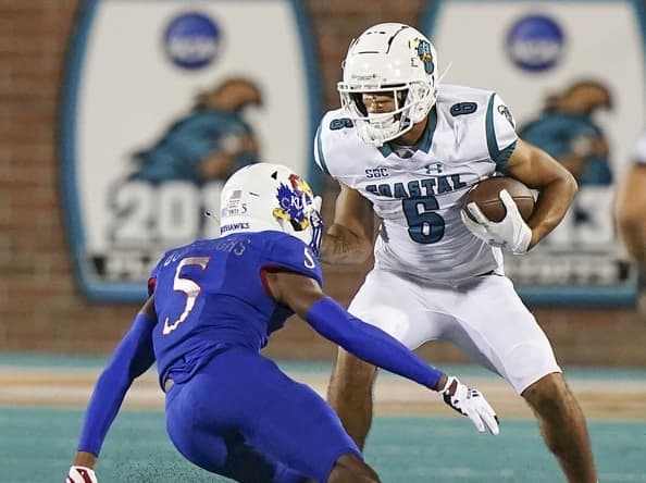Sep 10, 2021; Conway, South Carolina, USA;  Coastal Carolina Chanticleers wide receiver Jaivon Heiligh (6) moves the ball against Kansas Jayhawks safety O.J. Burroughs (5) during action at Brooks Stadium. Mandatory Credit: David Yeazell-USA TODAY Sports