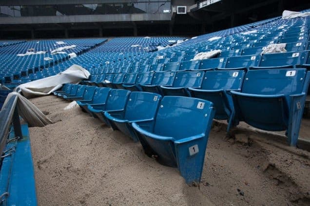 What appears to be leftover sand covers half of these seats.