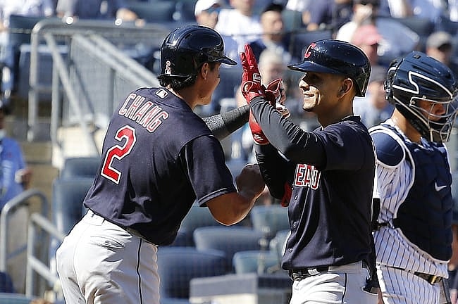Sep 18, 2021; Bronx, New York, USA; Cleveland Indians shortstop Andres Gimenez (0) is congratulated by first baseman Yu Chang (2) after hitting a three run home run against the New York Yankees during the fifth inning at Yankee Stadium. Mandatory Credit: Andy Marlin-USA TODAY Sports
