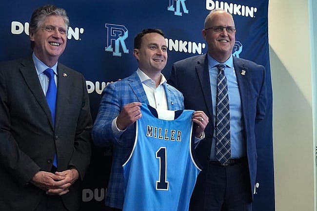 Rhode Island Governor Dan McKee and Director of Athletics Thorr Bjorn flank new University of RI Men s Basketball coach Archie Miller at the Welcome Center on March 21, 2022.