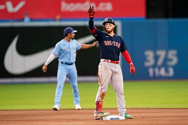 Aug 6, 2021; Toronto, Ontario, CAN; Boston Red Sox left fielder Alex Verdugo (99) celebrates after hitting a double play against the Toronto Blue Jays during the fourth inning at Rogers Centre. Mandatory Credit: Kevin Sousa-USA TODAY Sports