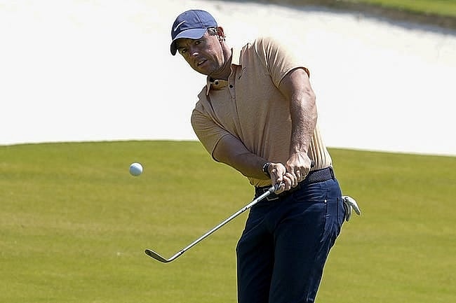 May 6, 2023; Charlotte, North Carolina, USA; Rory McIlroy pitches up to the 15th green during the third round of the Wells Fargo Championship golf tournament. Mandatory Credit: Jim Dedmon-USA TODAY Sports