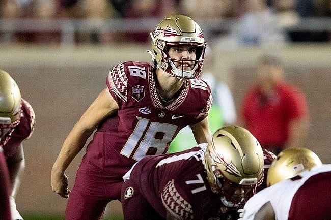 Florida State Seminoles quarterback Tate Rodemaker (18) talks to his teammates. The Florida State Seminoles defeated the Boston College Eagles 44-14 at Doak Campbell Stadium on Saturday, Sept. 24, 2022.

Fsu V Boston College Second005