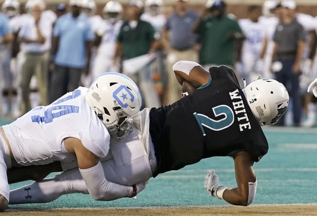 Sep 2, 2021; Conway, South Carolina, USA; Coastal Carolina Chanticleers running back Reese White (2) scores against Citadel Bulldogs defensive back Wilson Hendricks III (24) in the second quarter at Brooks Stadium. Mandatory Credit: David Yeazell-USA TODAY Sports