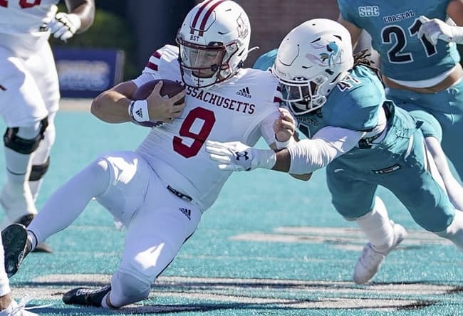 Sep 25, 2021; Conway, South Carolina, USA; Coastal Carolina Chanticleers linebacker Myles Olufemi (41) tackles Massachusetts Minutemen quarterback Garrett Dzuro (9)  in the NCAA football game of Massachusetts and Coastal Carolina at Brooks Stadium. Mandatory Credit: David Yeazell-USA TODAY Sports