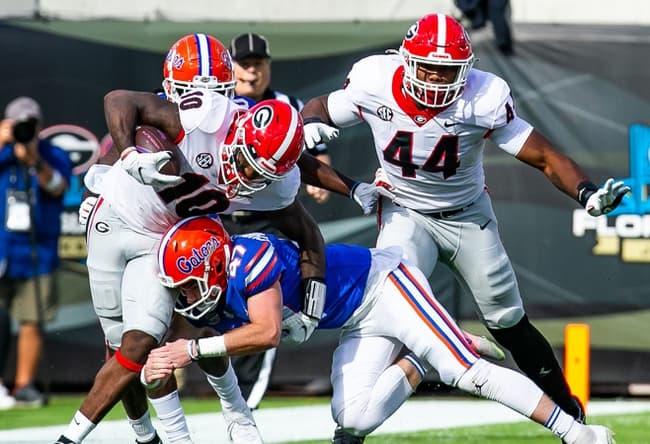 Florida Gators place kicker Jace Christmann (47) makes a touchdown saving tackles on Georgia Bulldogs wide receiver Kearis Jackson (10). The Florida Gators played the Georgia Bulldogs in the first half Saturday afternoon, October 30, 2021 at TIAA Bank Field in Jacksonville, FL. [Doug Engle/Gainesville Sun]2021

Flgai 103021 Bulldogsvsgators
